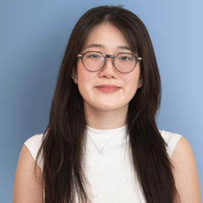 Celina headshot blue background